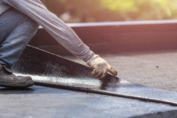 Professional Basement Waterproofing technician working in Newport, MN